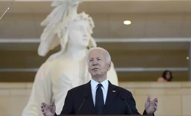 President Joe Biden speaks at the U.S. Holocaust Memorial Museum's Annual Days of Remembrance ceremony at the U.S. Capitol, Tuesday, May 7, 2024 in Washington. Statue of Freedom stands behind the President. (AP Photo/Evan Vucci)