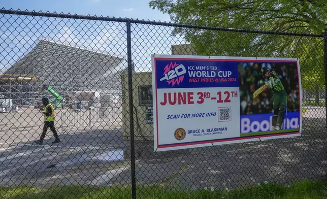 A sign advertises the Cricket World Cup matches in East Meadow, N.Y., Wednesday, May 8, 2024. As the U.S. prepares to host its first Cricket World Cup across three states next month, a temporary stadium is rising in the NYC suburbs where the English sport has found fertile ground among waves of Caribbean and South Asian immigration. (AP Photo/Seth Wenig)