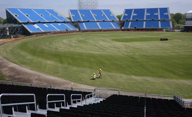 Work continues on a temporary stadium being constructed for the Cricket World Cup in East Meadow, N.Y., Wednesday, May 8, 2024. As the U.S. prepares to host its first Cricket World Cup across three states next month, a temporary stadium is rising in the NYC suburbs where the English sport has found fertile ground among waves of Caribbean and South Asian immigration. (AP Photo/Seth Wenig)