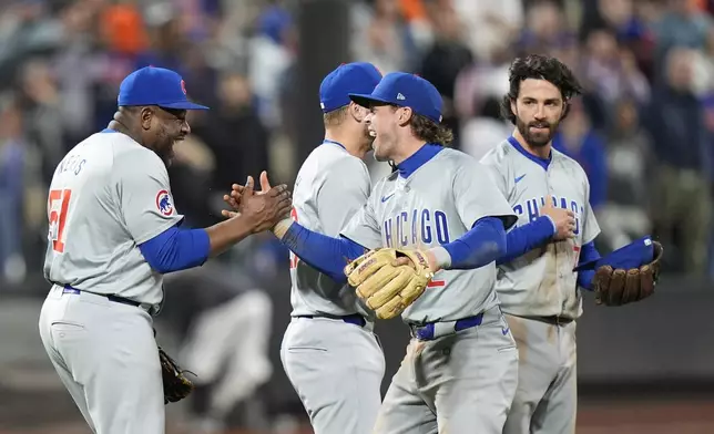 Chicago Cubs pitcher Héctor Neris, left, celebrates with teammate Nico Hoerner after a baseball game against the New York Mets, Wednesday, May 1, 2024, in New York. The Cubs won 1-0. (AP Photo/Frank Franklin II)