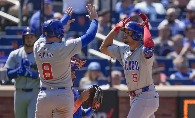 Chicago Cubs' Christopher Morel, right, celebrates his three-run homer with teammates during the fifth inning of a baseball game against the New York Mets at Citi Field, Thursday, May 2, 2024, in New York. (AP Photo/Seth Wenig)