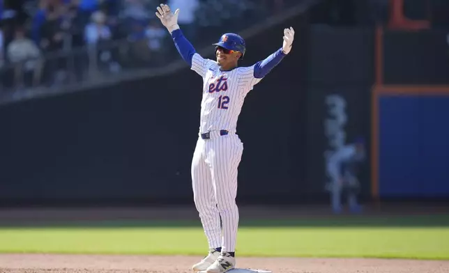 New York Mets' Francisco Lindor reacts after hitting a walk-off two-run double in the 11th inning of a baseball game against the Chicago Cubs at Citi Field, Thursday, May 2, 2024, in New York. The Mets defeated the Cubs 7-6 in 11 innings. (AP Photo/Seth Wenig)