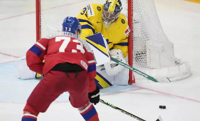 Czech Republic's Ondrej Kase scores his side's third goal during the semi final match between Sweden and Czech Republic at the Ice Hockey World Championships in Prague, Czech Republic, Saturday, May 25, 2024. (AP Photo/Darko Vojinovic)