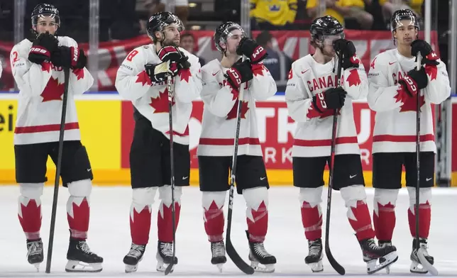 Canada's player stand on ice after the semifinal match between Canada and Switzerland at the Ice Hockey World Championships in Prague, Czech Republic, Saturday, May 25, 2024. (AP Photo/Petr David Josek)