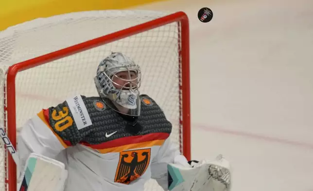 Germany's goalkeeper Philipp Grubauer makes a save during the preliminary round match between Slovakia and Germany at the Ice Hockey World Championships in Ostrava, Czech Republic, Friday, May 10, 2024. (AP Photo/Darko Vojinovic)