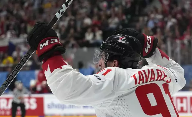 Canada's John Tavares celebrates after scoring his sides second goal during the semifinal match between Canada and Switzerland at the Ice Hockey World Championships in Prague, Czech Republic, Saturday, May 25, 2024. (AP Photo/Petr David Josek)