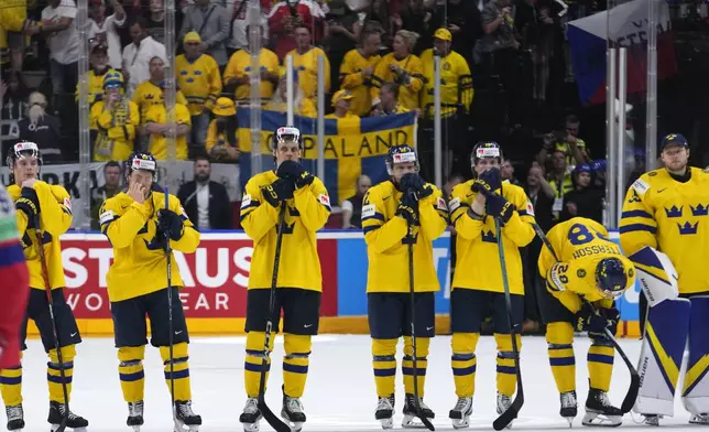 Sweden's players satnd on ice after the semifinal match between Czech Republic and Sweden at the Ice Hockey World Championships in Prague, Czech Republic, Saturday, May 25, 2024. (AP Photo/Petr David Josek)