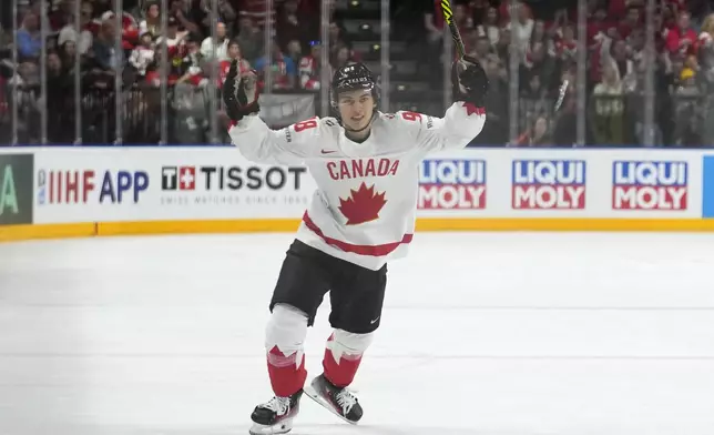 Canada's Connor Bedard celebrates his sides second goal during the semifinal match between Canada and Switzerland at the Ice Hockey World Championships in Prague, Czech Republic, Saturday, May 25, 2024. (AP Photo/Petr David Josek)