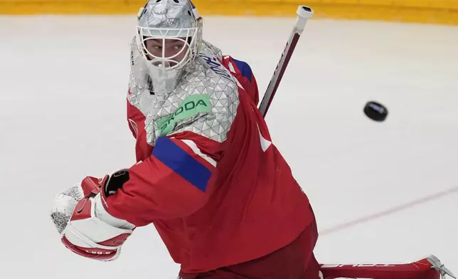 Czech Republic's goalkeeper Lukas Dostal makes a save during the semi final match between Sweden and Czech Republic at the Ice Hockey World Championships in Prague, Czech Republic, Saturday, May 25, 2024. (AP Photo/Darko Vojinovic)