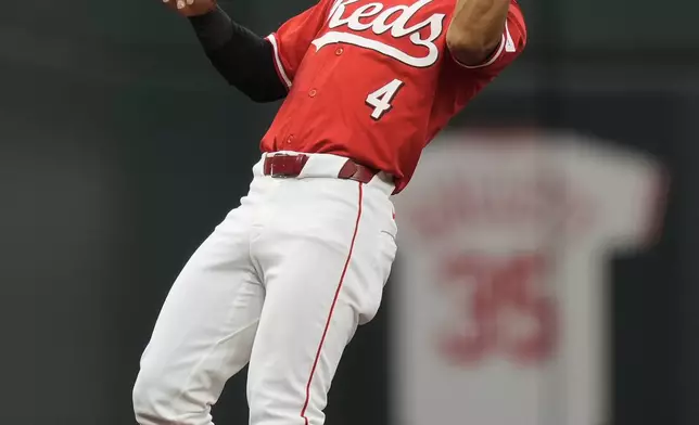Cincinnati Reds third baseman Santiago Espinal catches a popup hit by Arizona Diamondbacks' Ketel Marte during the first inning of a baseball game Wednesday, May 8, 2024, in Cincinnati. (AP Photo/Carolyn Kaster)