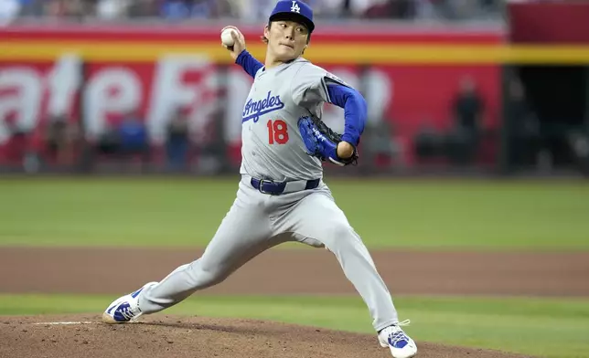 Los Angeles Dodgers starting pitcher Yoshinobu Yamamoto, of Japan, throws against the Arizona Diamondbacks during the first inning of a baseball game Wednesday, May 1, 2024, in Phoenix. (AP Photo/Ross D. Franklin)