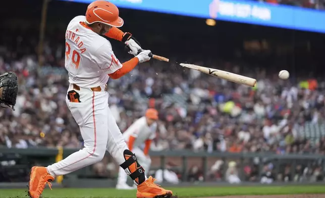 San Francisco Giants' Thairo Estrada shatters his bat while grounding out to Los Angeles Dodgers first baseman Freddie Freeman during the third inning of a baseball game Tuesday, May 14, 2024, in San Francisco. (AP Photo/Godofredo A. Vásquez)