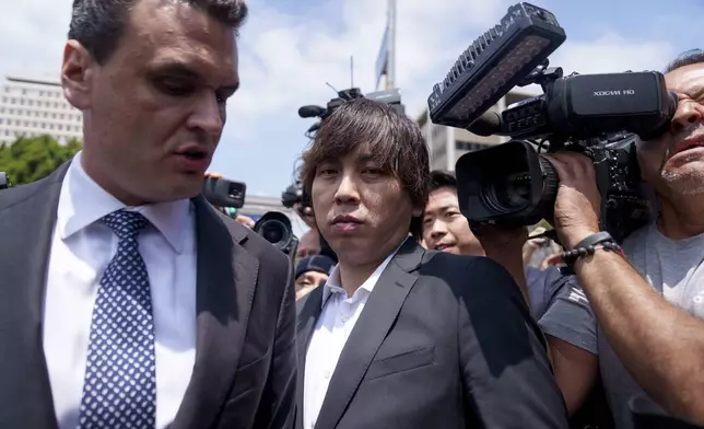 Ippei Mizuhara, the former longtime interpreter for the Los Angeles Dodgers baseball star Shohei Ohtani, leaves federal court following his arraignment, Tuesday, May 14, 2024, in Los Angeles. Mizuhara pleaded not guilty Tuesday to bank and tax fraud, a formality ahead of a plea deal he’s negotiated with federal prosecutors in a wide-ranging sports betting case. (AP Photo/Eric Thayer)