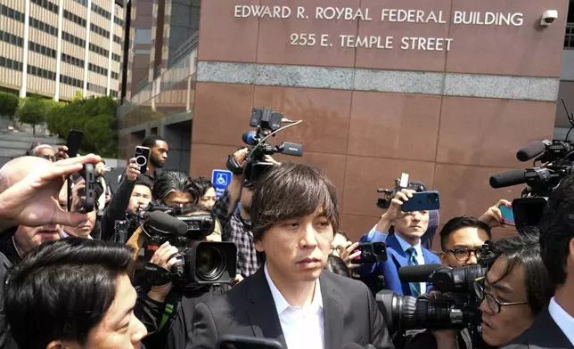 Ippei Mizuhara, the former longtime interpreter for the Los Angeles Dodgers baseball star Shohei Ohtani, leaves federal court following his arraignment, Tuesday, May 14, 2024 in Los Angeles. Mizuhara pleaded not guilty Tuesday to bank and tax fraud, a formality ahead of a plea deal he’s negotiated with federal prosecutors in a wide-ranging sports betting case. (AP Photo/Damian Dovarganes)