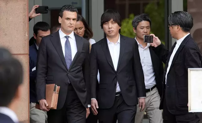 Ippei Mizuhara, the former longtime interpreter for the Los Angeles Dodgers baseball star Shohei Ohtani, leaves federal court following his arraignment, Tuesday, May 14, 2024 in Los Angeles. Mizuhara pleaded not guilty Tuesday to bank and tax fraud, a formality ahead of a plea deal he’s negotiated with federal prosecutors in a wide-ranging sports betting case. (AP Photo/Damian Dovarganes)