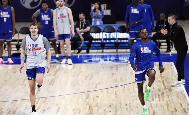 Baylor Scheierman, left, and Bronny James warm up during the 2024 NBA basketball Draft Combine in Chicago, Tuesday, May 14, 2024. (AP Photo/Nam Y. Huh)