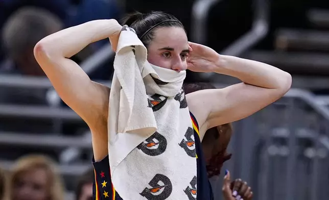 Indiana Fever guard Caitlin Clark reacts after a teammate's basket against the Atlanta Dream during the first half of a preseason WNBA basketball game in Indianapolis, Thursday, May 9, 2024. (AP Photo/Darron Cummings)