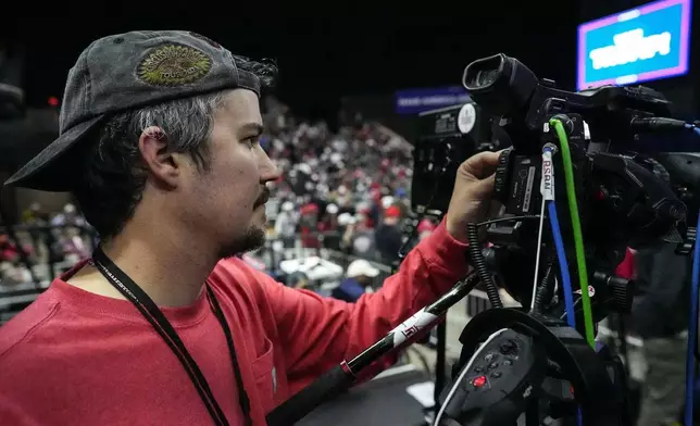 Will Lawrence with Right Side Broadcasting Network prepares for Republican presidential candidate former President Donald Trump to speak in Rome, Ga., on Saturday, March 9, 2024. (AP Photo/Mike Stewart)