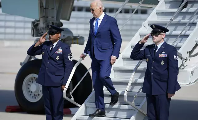 President Joe Biden arrives at Chicago O'Hare International Airport to attend a political fundraiser, Wednesday, May 8, 2024, in Chicago. (AP Photo/Evan Vucci)