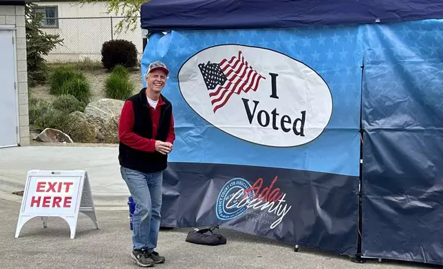 Retired Idaho deputy attorney general Brett DeLange leaves a mobile voting tent in Boise, Idaho, after taking part in early voting for the state primary on Monday, May 6, 2024. Idaho's primary elections are currently closed – meaning residents generally must choose the ballots associated with the political party they have affiliated with – but a voter initiative is likely to be on the ballot this fall that could switch the state to open primaries and create a ranked-choice voting system. (AP Photo/Rebecca Boone)