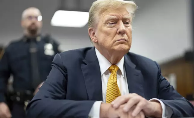 FILE - Former President Donald Trump sits in Manhattan criminal court, May 21, 2024, in New York. Trump has spent the majority of his time as a criminal defendant sitting nearly motionless, for hours, leaning back in his chair with his eyes closed, so zen he often appeared to be asleep. It is, at least in part, a strategy in response to warnings that behaving like he has in past trials could backfire. (Justin Lane/Pool Photo via AP, File)
