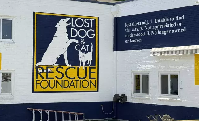 The Lost Dog and Cat Rescue Foundation signage is displayed on its building in Falls Church, Va. Friday, May 24, 2024. A woman is seeking answers after the sick dog she took to the foundation to have euthanized turned up more than a year later on a rescue adoption site. (AP Photo/Matthew Barakat)