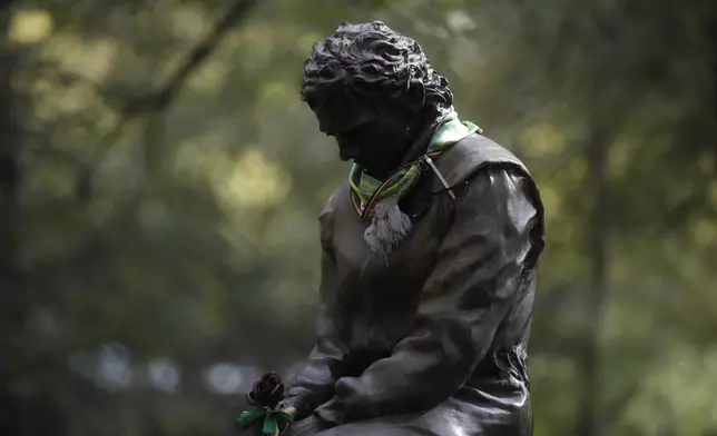 FILE - A scarf has been placed on a statue of Brazilian race car driver Ayrton Senna ahead of Sunday's Emilia Romagna Formula One Grand Prix, at the Dino and Enzo Ferrari racetrack, in Imola, Italy, Friday, Oct. 30, 2020. The 30th anniversary of Ayrton Senna’s death is commemorated on Wednesday, May 1, 2024, with a memorial on the Imola track where he crashed during the 1994 San Marino Grand Prix. (AP Photo/Luca Bruno, File)