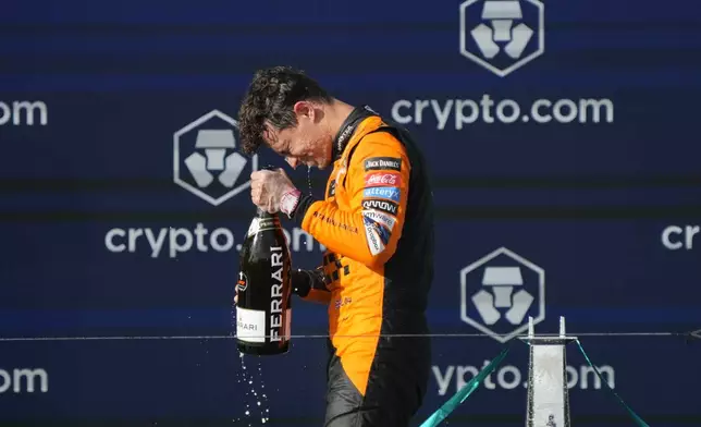 McLaren driver Lando Norris, of Britain, celebrates after winning the Formula One Miami Grand Prix auto race at the Miami International Autodrome, Sunday, May 5, 2024, in Miami Gardens, Fla. (AP Photo/Wilfredo Lee)