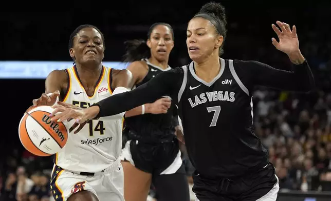 Las Vegas Aces forward Alysha Clark (7) steals the ball from Indiana Fever center Temi Fagbenle (14) during the second half of a WNBA basketball game Saturday, May 25, 2024, in Las Vegas. (AP Photo/John Locher)