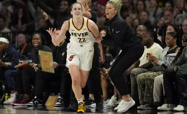 Indiana Fever guard Caitlin Clark (22) reacts after a play against the Las Vegas Aces during the first half of a WNBA basketball game Saturday, May 25, 2024, in Las Vegas. (AP Photo/John Locher)