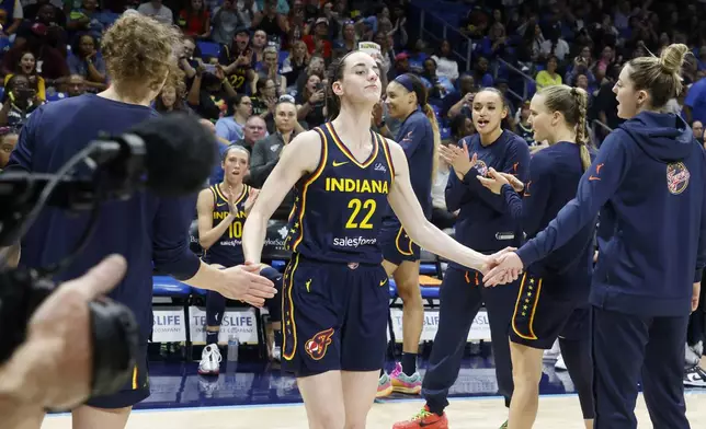 Indiana Fever guard Caitlyn Clark (22) is introduced during the first half of an WNBA basketball game against the Dallas Wings in Arlington, Texas, Friday, May 3, 2024. (AP Photo/Michael Ainsworth)