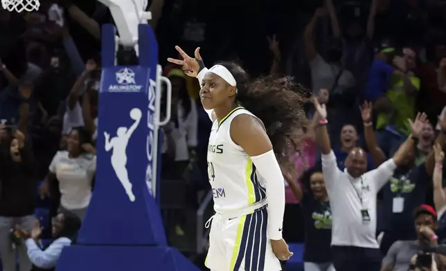 Dallas Wings guard Arike Ogunbowale (24) celebrates her winning three-point shot against the Indiana Fever during the second half of an WNBA basketball game in Arlington, Texas, Friday, May 3, 2024. (AP Photo/Michael Ainsworth)
