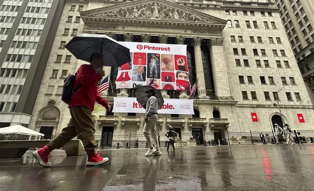 Banners for Pinterest, displayed to mark the fifth anniversary of the company's listing, hang on the front of the New York Stock Exchange in New York on Wednesday, May 15, 2024. U.S. stocks are rising toward records with hope that inflation is heading back in the right direction. (AP Photo/Peter Morgan)