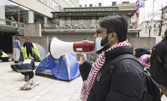 Supporters of Palestinians attend a protest rally outside the Helsinki University in Helsinki, Finland, Monday, May 6, 2024. Demonstrators are demanding boycott against Israeli universities. (Roni Rekomaa/Lehtikuva via AP)