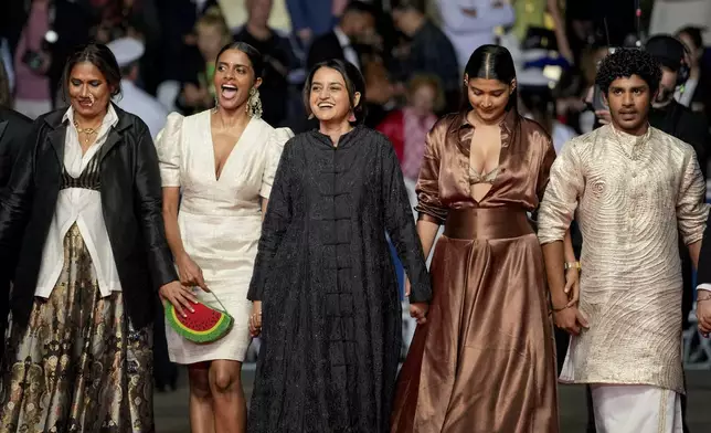 Chhaya Kadam, from left, Kani Kusruti, director Payal Kapadia, Divya Prabha and Hridhu Haroon pose for photographers upon arrival at the premiere of the film 'All We Imagine as Light' at the 77th international film festival, Cannes, southern France, Thursday, May 23, 2024. (Photo by Andreea Alexandru/Invision/AP)