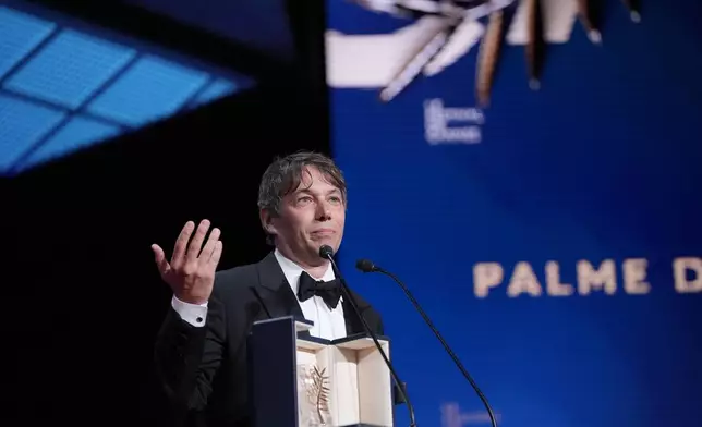 Sean Baker accepts the Palme d'Or for the film 'Anora,' during the awards ceremony of the 77th international film festival, Cannes, southern France, Saturday, May 25, 2024 (Photo by Andreea Alexandru/Invision/AP)