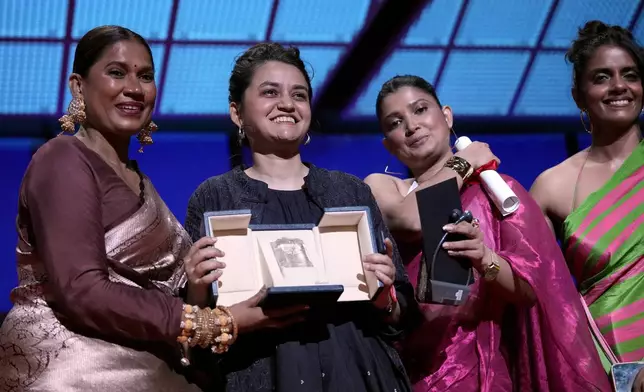 Chhaya Kadam, from left, director Payal Kapadia, Divya Prabha, and Kani Kusruti accept the grand prize award for 'All We Imagine as Light,' during the awards ceremony of the 77th international film festival, Cannes, southern France, Saturday, May 25, 2024 (Photo by Andreea Alexandru/Invision/AP)