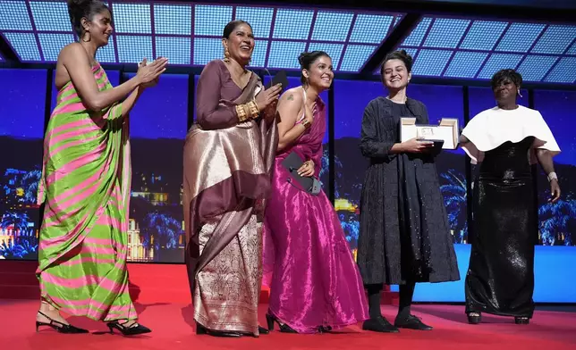 Kani Kusruti, from left, Chhaya Kadam, Divya Prabha and director Payal Kapadia accept the grand prize award for 'All We Imagine as Light,' alongside Viola Davis, far right, during the awards ceremony of the 77th international film festival, Cannes, southern France, Saturday, May 25, 2024 (Photo by Andreea Alexandru/Invision/AP)