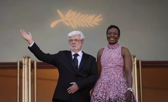 George Lucas, left, and Mellody Hobson pose for photographers upon arrival at the awards ceremony during the 77th international film festival, Cannes, southern France, Saturday, May 25, 2024. (Photo by Andreea Alexandru/Invision/AP)