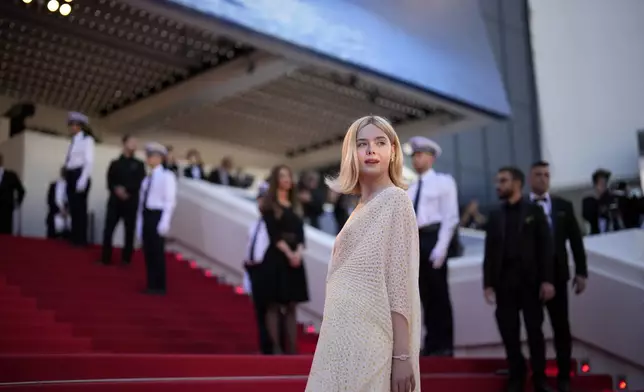 Elle Fanning poses for photographers upon arrival at the awards ceremony during the 77th international film festival, Cannes, southern France, Saturday, May 25, 2024. (Photo by Andreea Alexandru/Invision/AP)