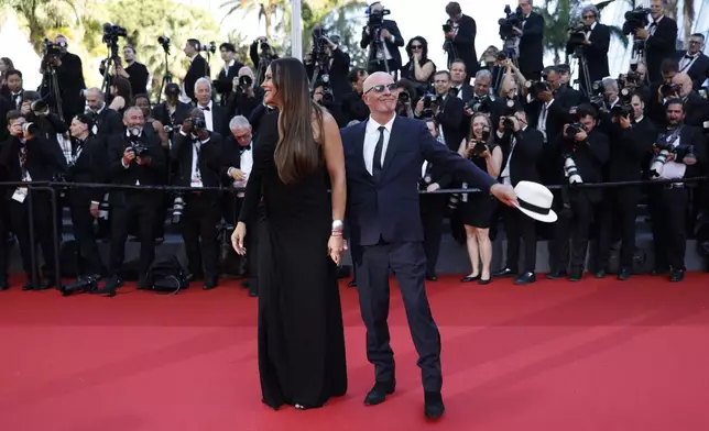 Karla Sofia Gascon, left, and Jacques Audiard pose for photographers upon arrival at the awards ceremony during the 77th international film festival, Cannes, southern France, Saturday, May 25, 2024. (Photo by Vianney Le Caer/Invision/AP)