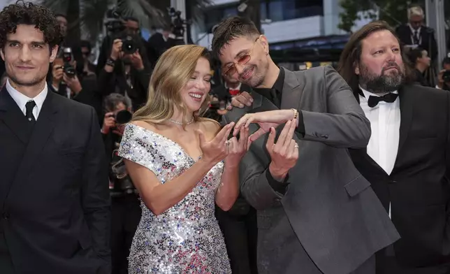 Louis Garrel, from left, Lea Seydoux, Raphael Quenard, and Manuel Guillot pose for photographers upon arrival at the awards ceremony and the premiere of the film 'The Second Act' during the 77th international film festival, Cannes, southern France, Tuesday, May 14, 2024. (Photo by Scott A Garfitt/Invision/AP)