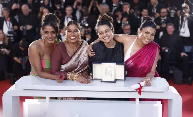 Payal Kapadia, second from right, winner of the grand prize for 'All We Imagine as Light,' poses with Kani Kusruti, from left, Chhaya Kadam, and Divya Prabha during the photo call following the awards ceremony at the 77th international film festival, Cannes, southern France, Saturday, May 25, 2024. (Photo by Vianney Le Caer/Invision/AP)