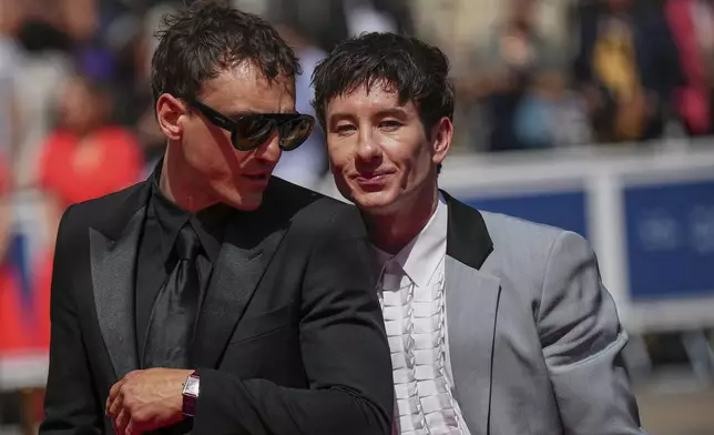 Franz Rogowski, left, and Barry Keoghan pose for photographers upon arrival at the premiere of the film 'Bird' at the 77th international film festival, Cannes, southern France, Thursday, May 16, 2024. (Photo by Daniel Cole/Invision/AP)