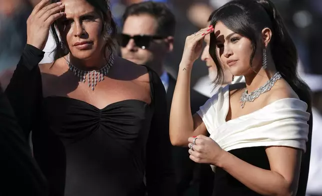 Karla Sofía Gascon,left, and Selena Gomez pose for photographers upon arrival at the premiere of the film 'Emilia Perez' at the 77th international film festival, Cannes, southern France, Saturday, May 18, 2024. (Photo by Scott A Garfitt/Invision/AP)