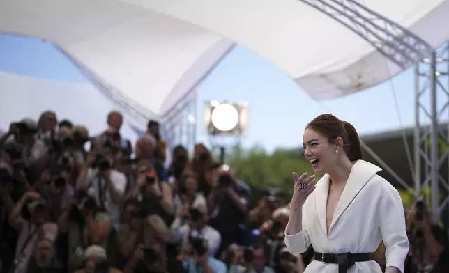 Emma Stone oses for photographers at the photo call for the film 'Kinds of Kindness' at the 77th international film festival, Cannes, southern France, Saturday, May 18, 2024. (Photo by Daniel Cole/Invision/AP)