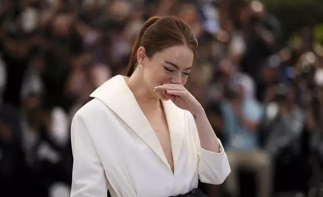 Emma Stone poses for photographers at the photo call for the film 'Kinds of Kindness' at the 77th international film festival, Cannes, southern France, Saturday, May 18, 2024. (Photo by Daniel Cole/Invision/AP)