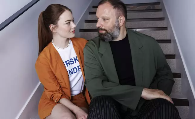 Emma Stone, left, and director Yorgos Lanthimos pose for a portrait photograph for the film 'Kinds of Kindness' at the 77th international film festival, Cannes, southern France, Saturday, May 18 2024. (Photo by Vianney Le Caer/Invision/AP)