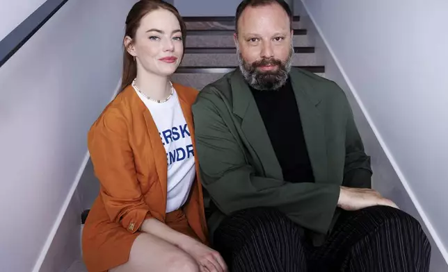 Emma Stone, left, and director Yorgos Lanthimos pose for a portrait photograph for the film 'Kinds of Kindness' at the 77th international film festival, Cannes, southern France, Saturday, May 18 2024. (Photo by Vianney Le Caer/Invision/AP)