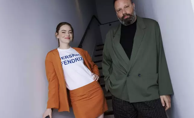 Emma Stone, left, and director Yorgos Lanthimos pose for a portrait photograph for the film 'Kinds of Kindness' at the 77th international film festival, Cannes, southern France, Saturday, May 18 2024. (Photo by Vianney Le Caer/Invision/AP)